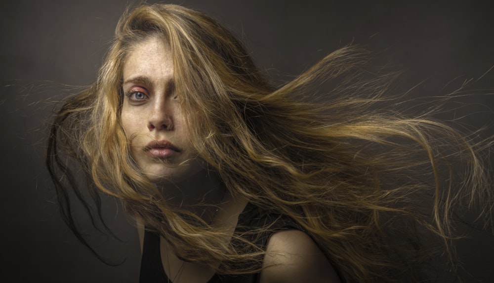 blonde haired woman wearing black top