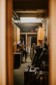 man with guitar in room