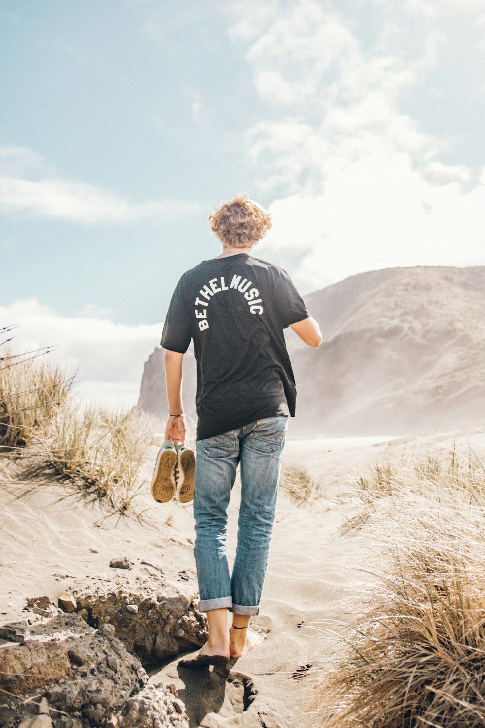 man walking on open field