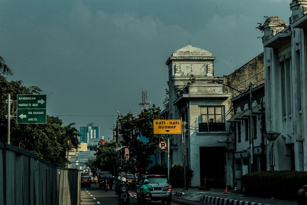 a city street with a clock tower in the background