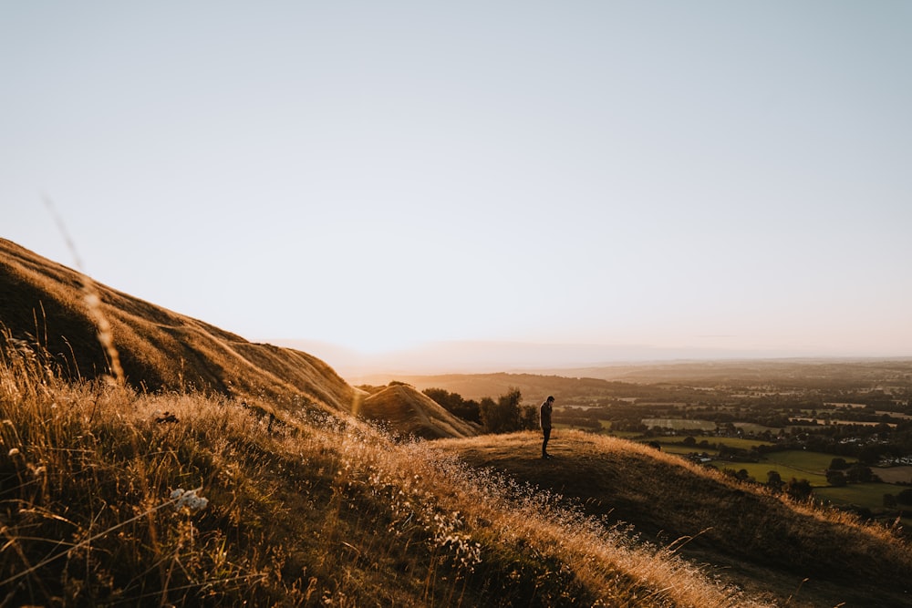 person standing on top of mountain