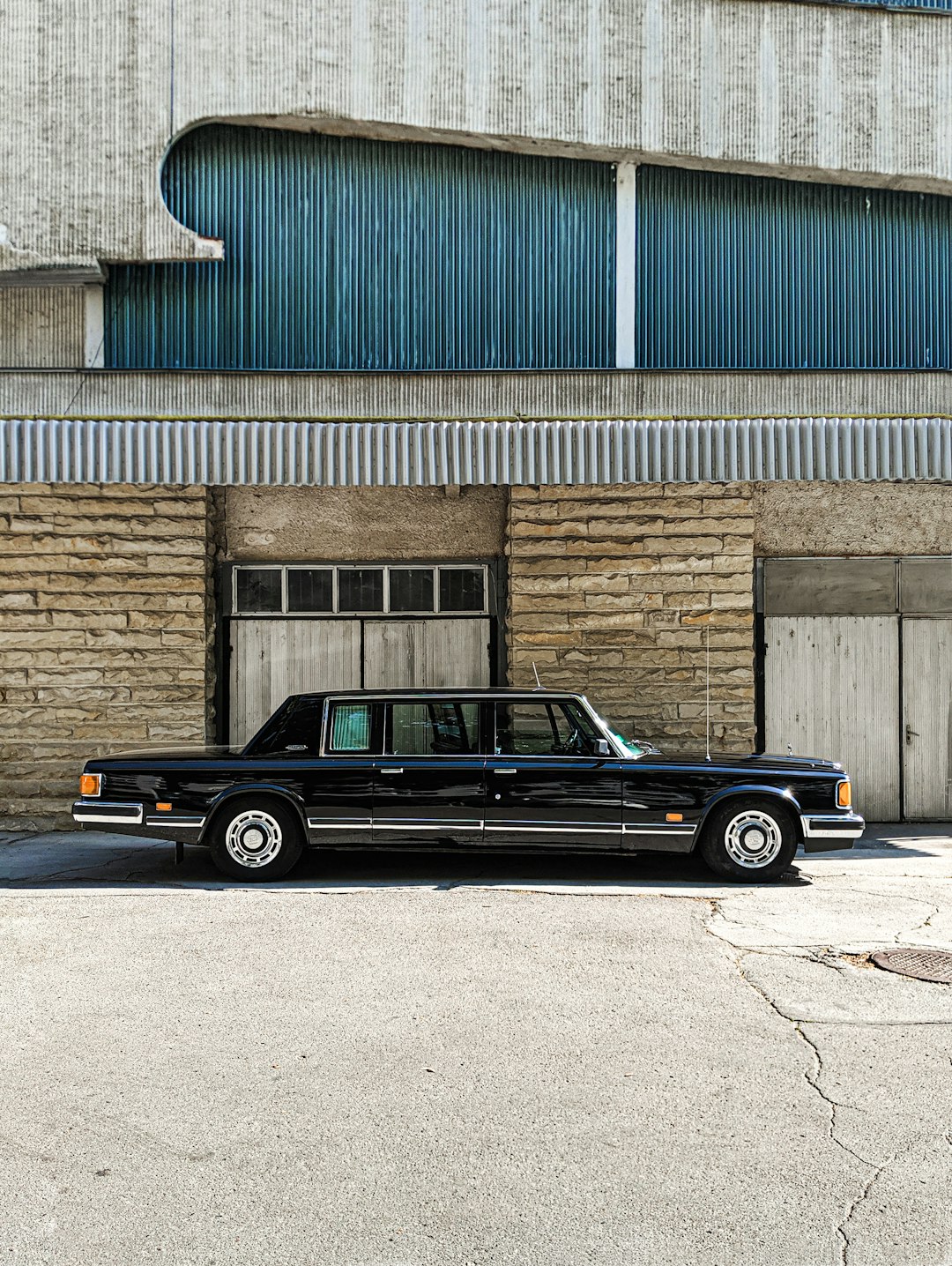 black limousine parked outside building