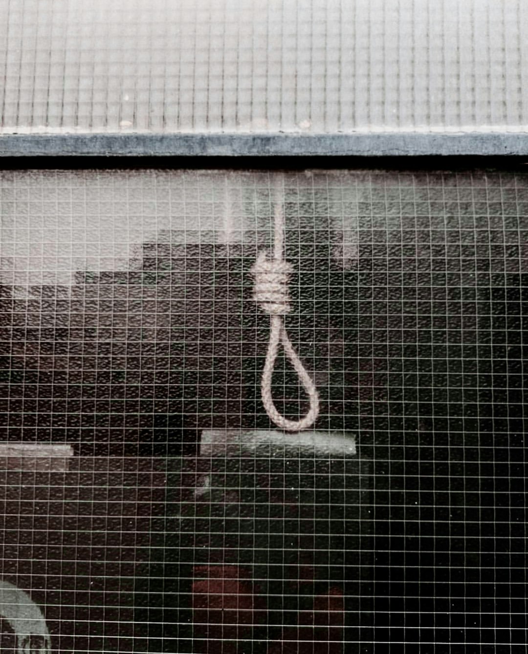 a close up of a window with a rope attached to it