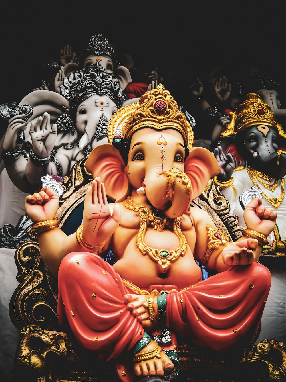 three Lord Ganesha statuettes