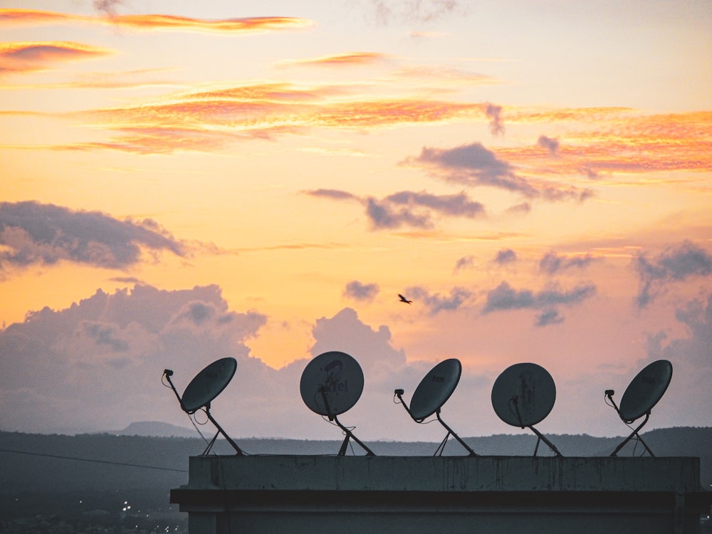 five parabolic dishes on roof