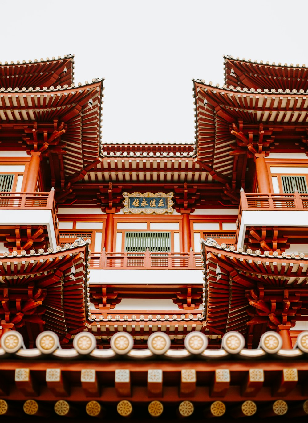 low angle photo of orange and white wooden house