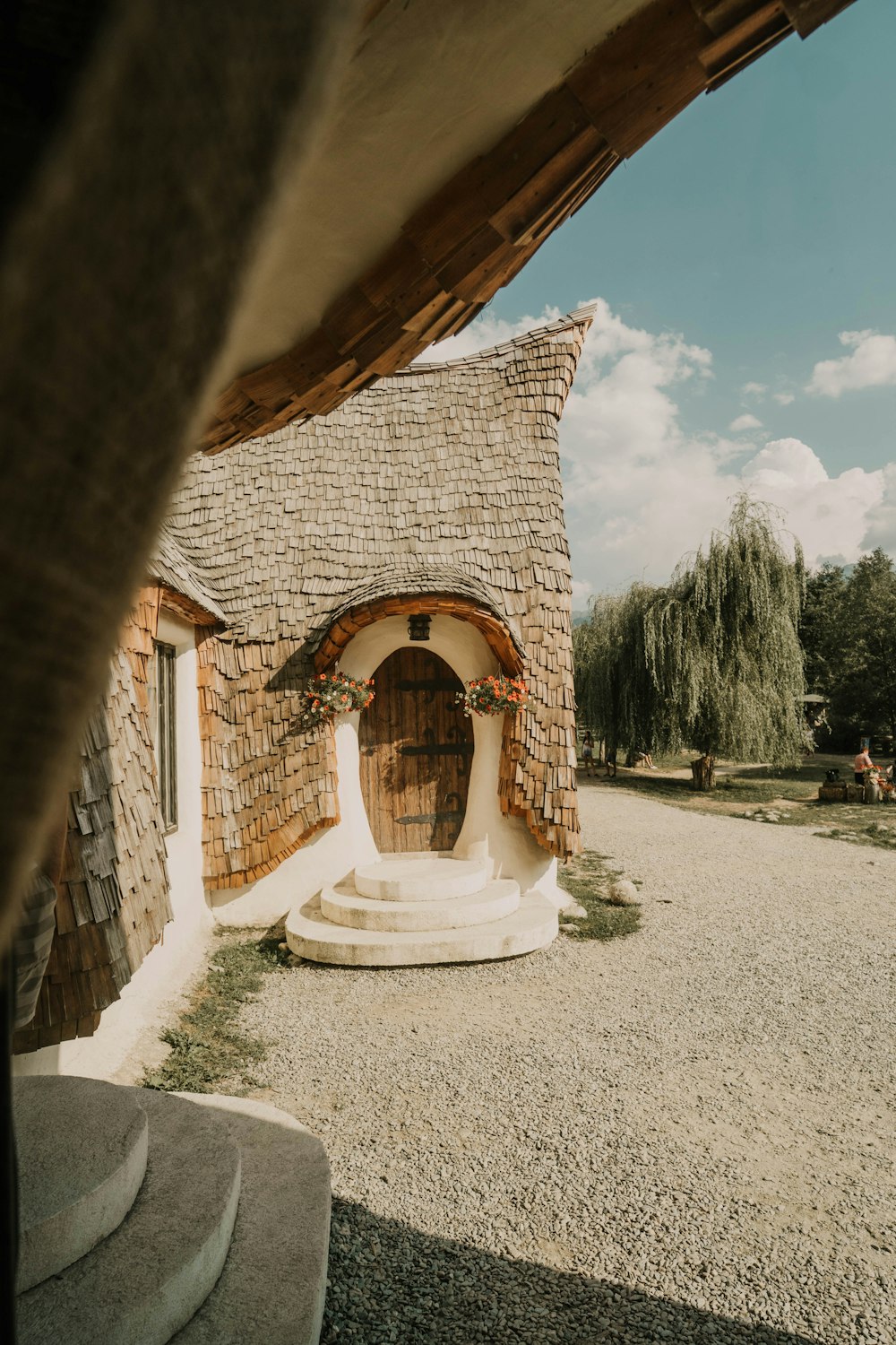 a stone house with a thatched roof