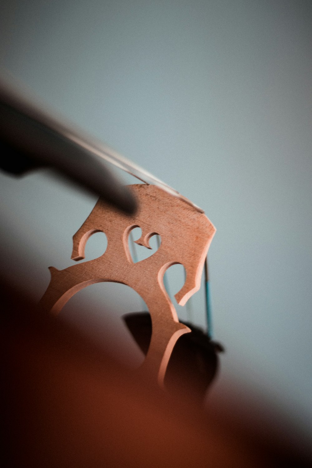 a wooden ring with hearts cut out of it