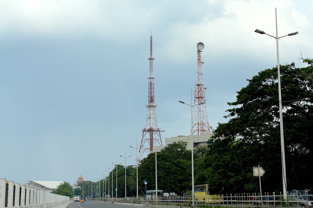 few vehicles on road viewing power satellite during daytime