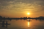 silhouette of person riding on boat
