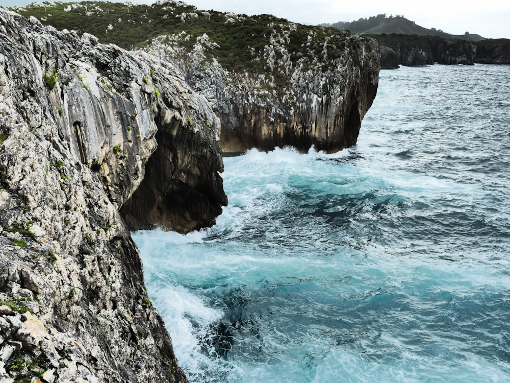 sea and cliff during daytime