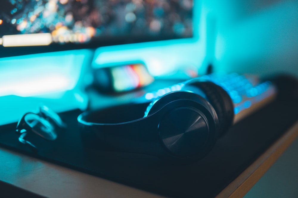 a close up of a gaming mouse and a computer monitor