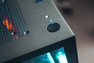 A close-up of a refurbished desktop computer tower with visible ports and a modern keyboard beside it.