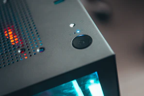 A close-up of a refurbished desktop computer tower with visible ports and a modern keyboard beside it.