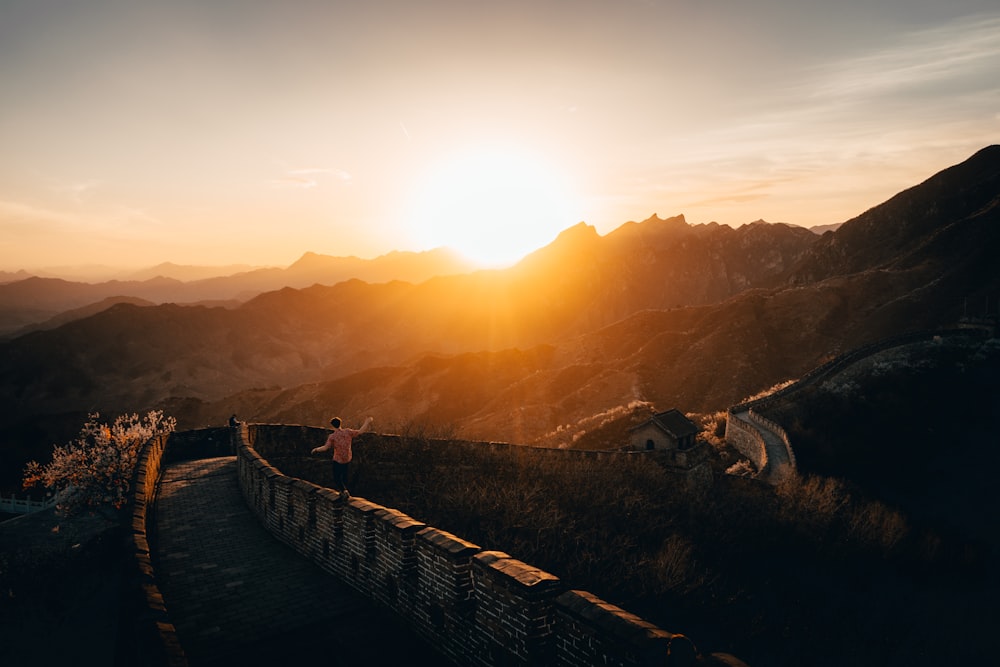 person walking on walls of Great Wall of China