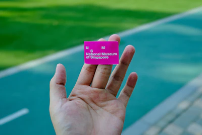 Close-up of a hand holding a ticket for a Santuario de Las Lajas guided tour.