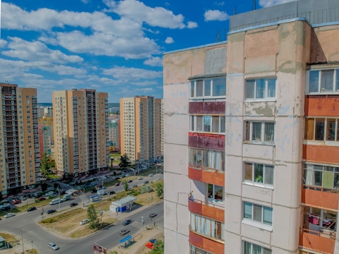High-rise city apartment complex with bustling streets below.