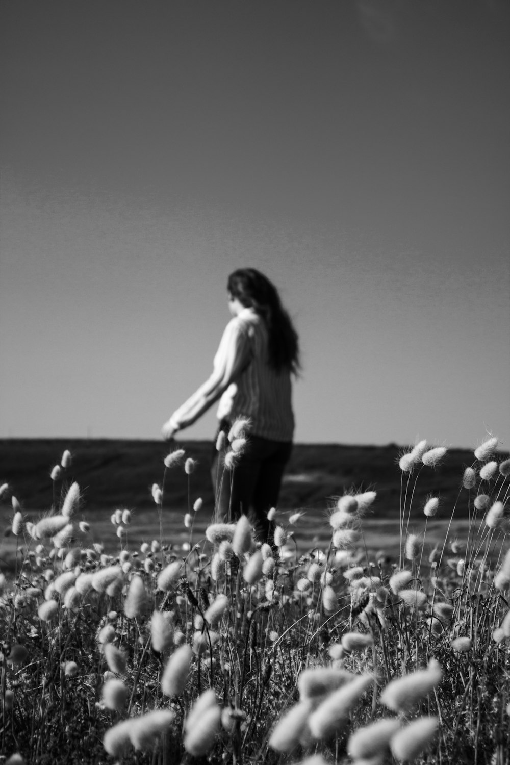 grayscale photography unknown person standing outdoors