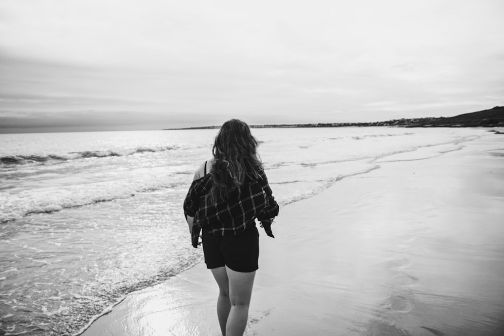 woman walking on shore