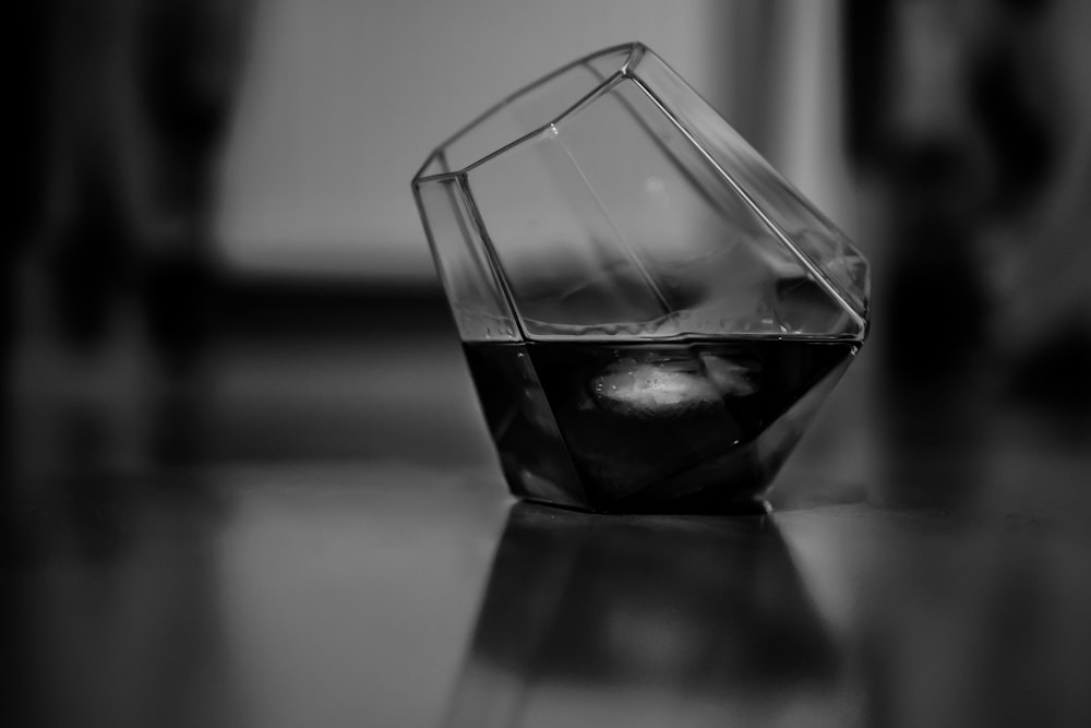grayscale photo of drinking glass