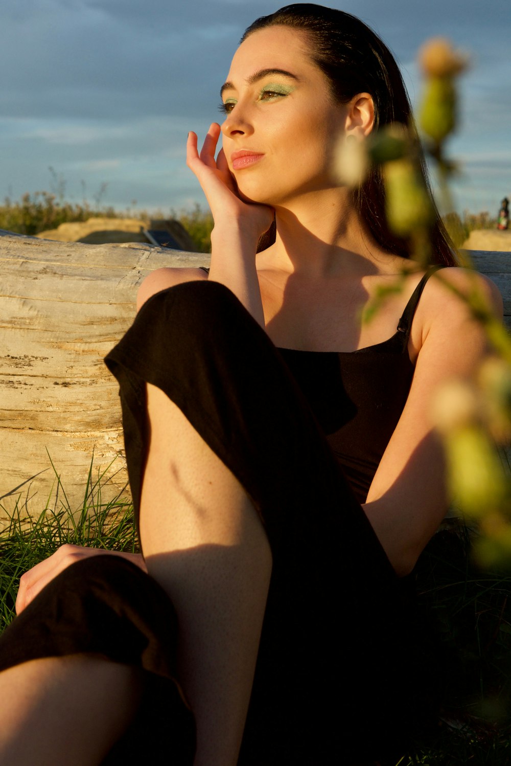 woman sitting on grass