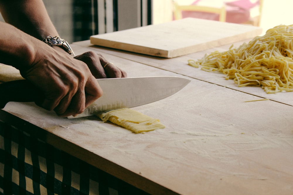 person chopping dough