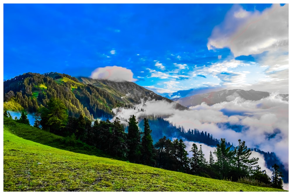 green mountains under cloudy sky