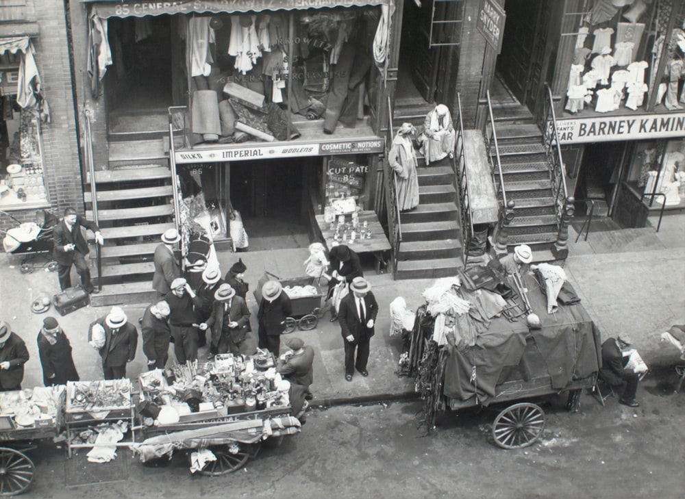 grayscale photo of people on pier