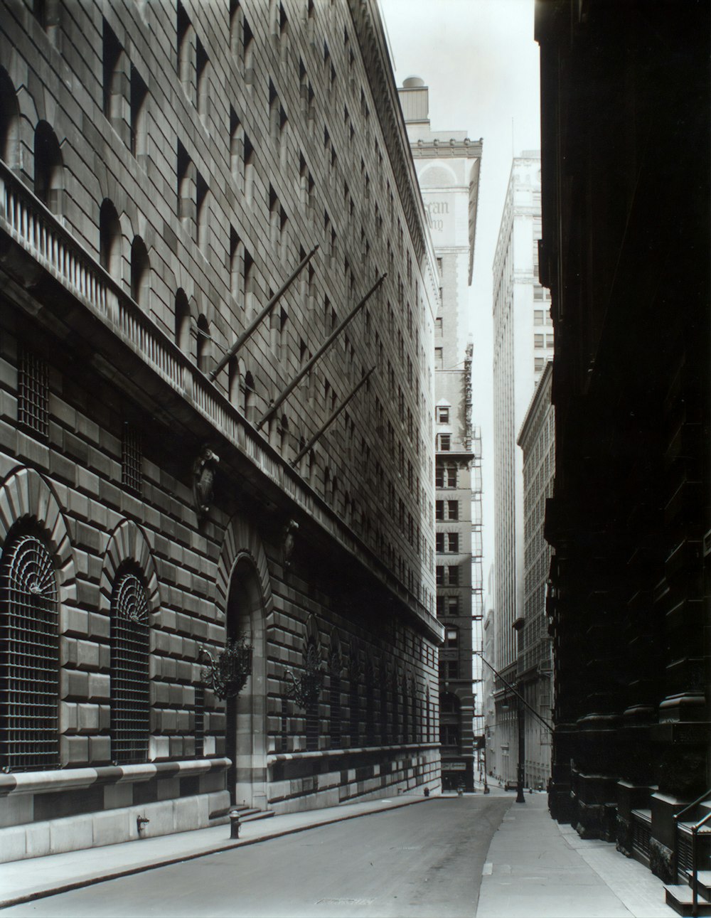 paved road between high-rise builidings