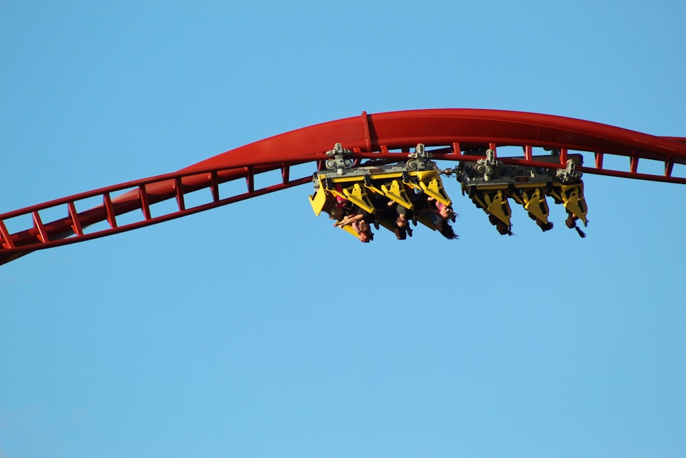 people riding roller coaster