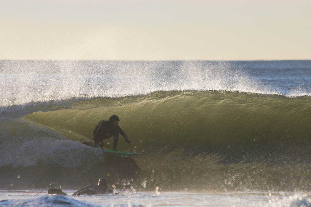 man surfing on beach