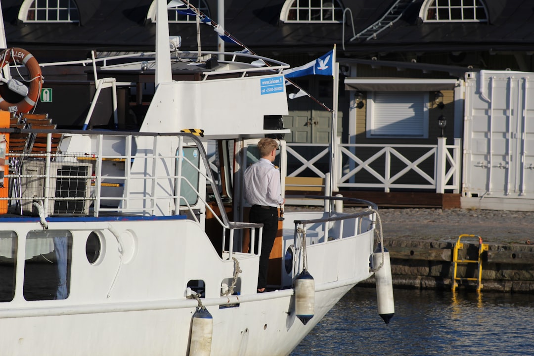 man standing on boat