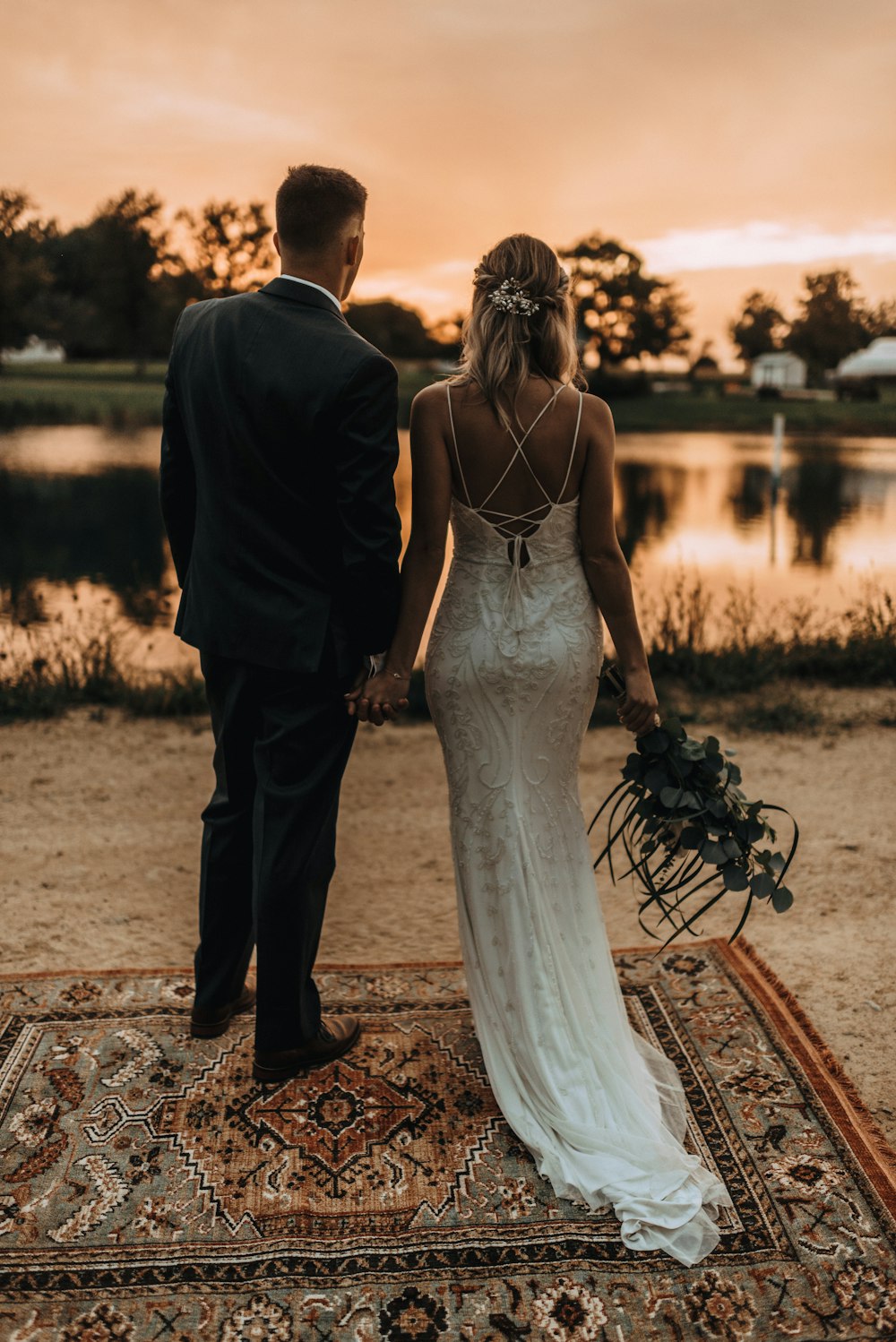 wedding couple standing on area rug