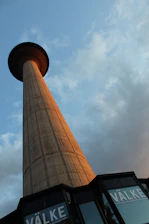 Photo of the Suttner GmbH office building at Alkenbrede 1 in Lemgo, bathed in warm afternoon light.