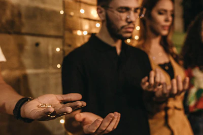A warm gathering of diverse people holding hands in a circle under soft natural light