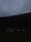 Evening lights glowing warmly from cabins nestled in the foothills of the Smokies