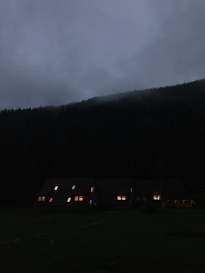 Evening lights glowing warmly from cabins nestled in the foothills of the Smokies