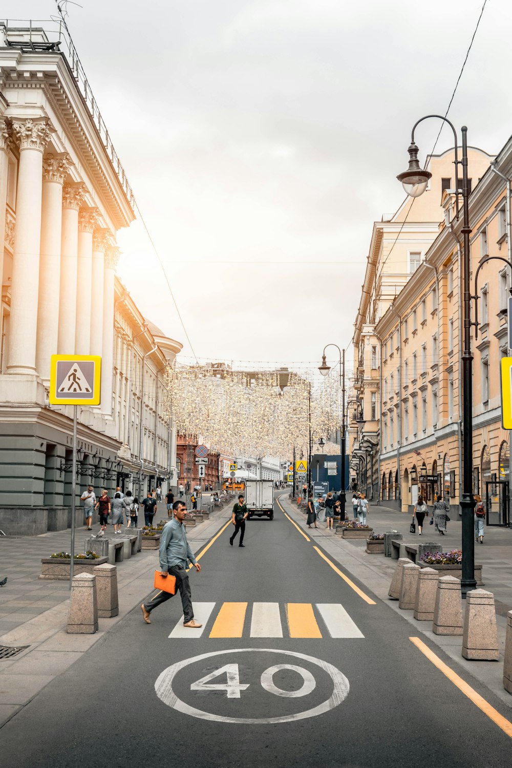 man walking in pedestrian lane