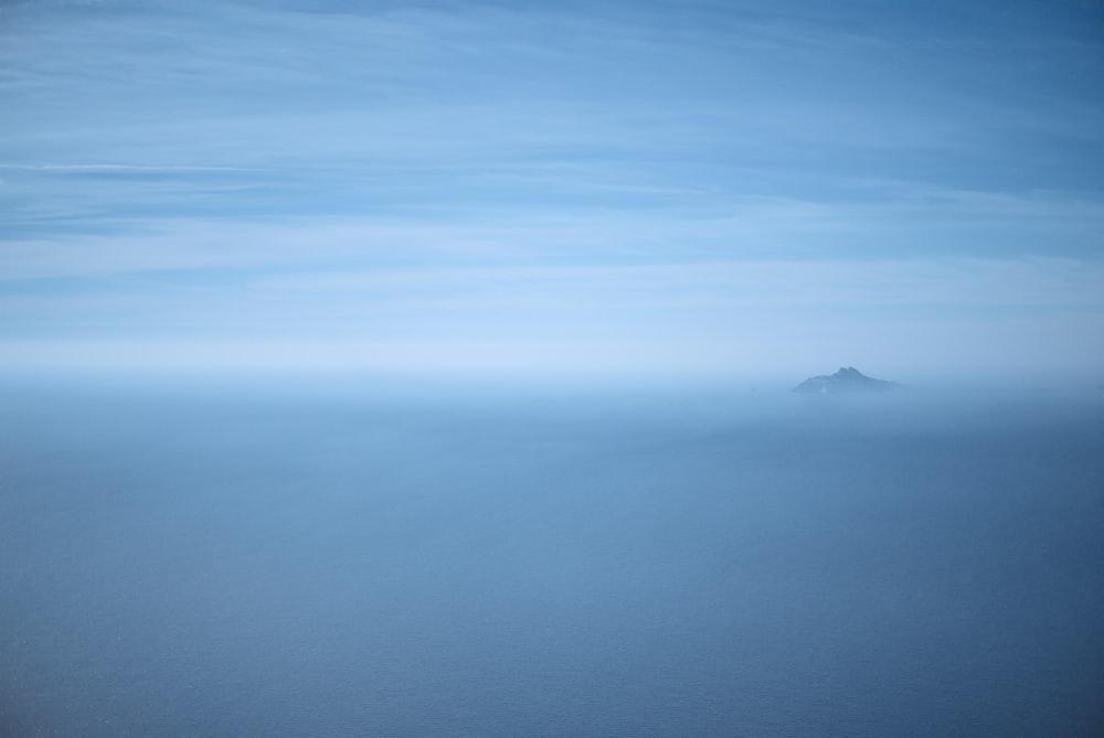 silhouette of mountain and sea of clouds