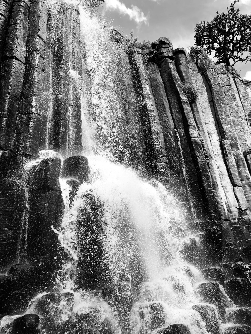 grayscale photo of waterfalls