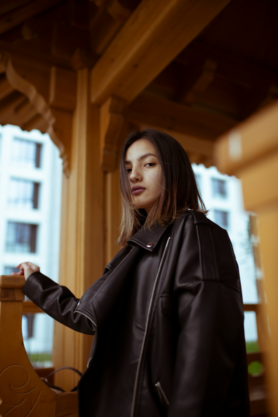 woman wearing black leather jacket