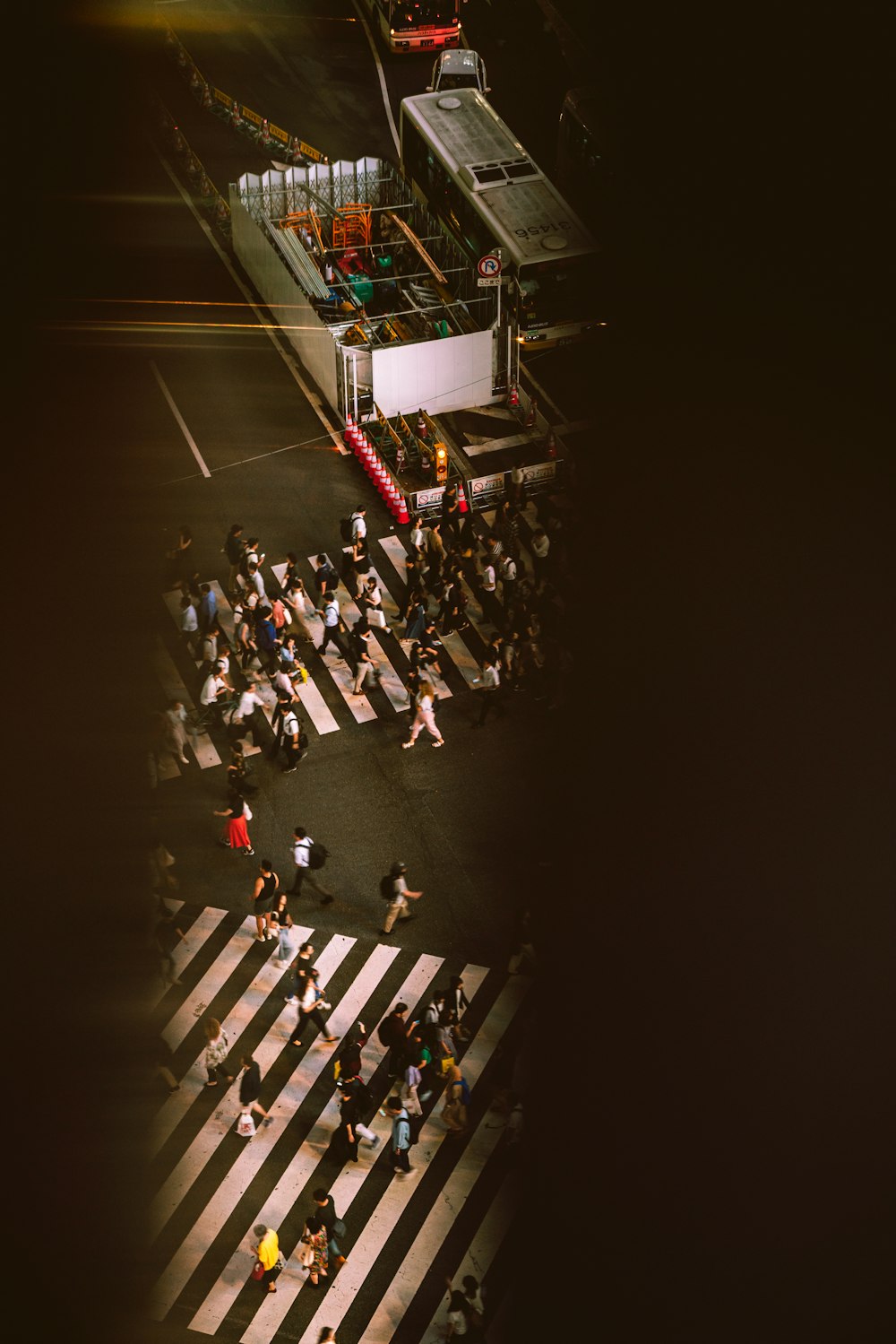 people crossing the crossroads