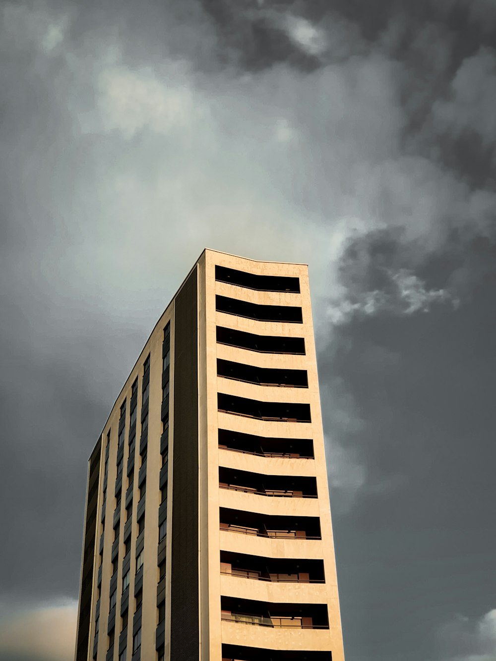 low angle photo of beige concrete building