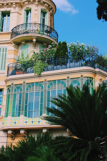 Close-up of Jasmine Sharm’s elegant facade with lush landscaping and inviting balconies.