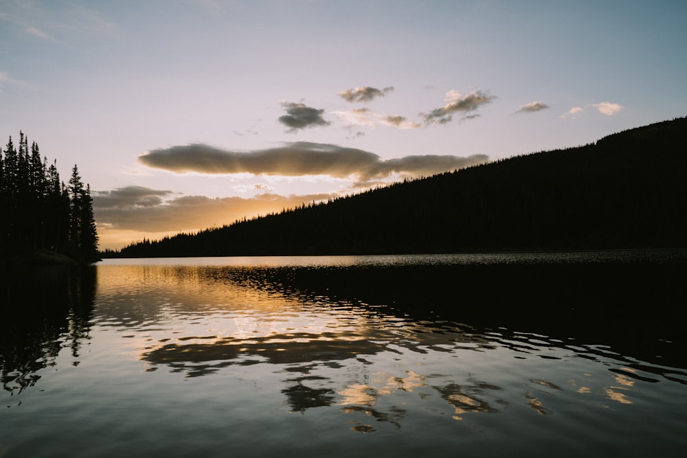 body of water under blue sky