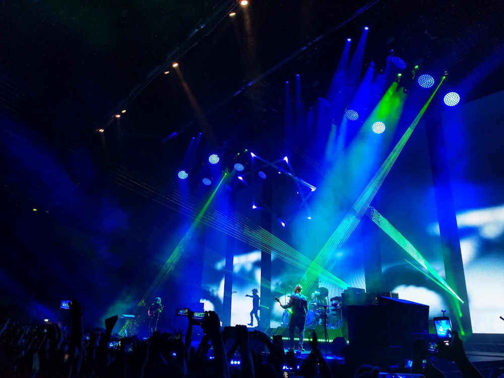 a group of people standing on top of a stage