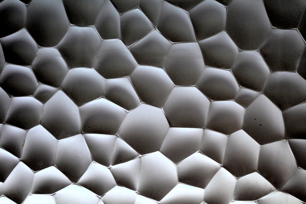 a close up view of a wall made of hexagonal shapes