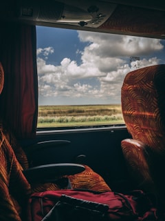 A scenic view from the window of a Fogaça Transporte bus.