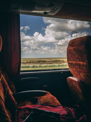 A scenic view from the window of a Fogaça Transporte bus.