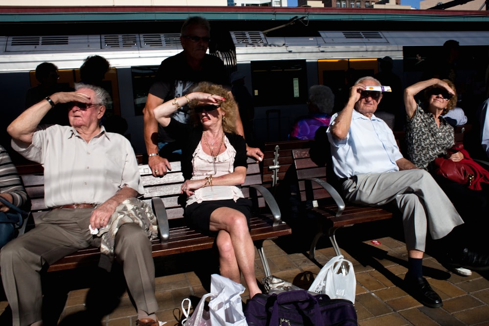 people sitting on bench